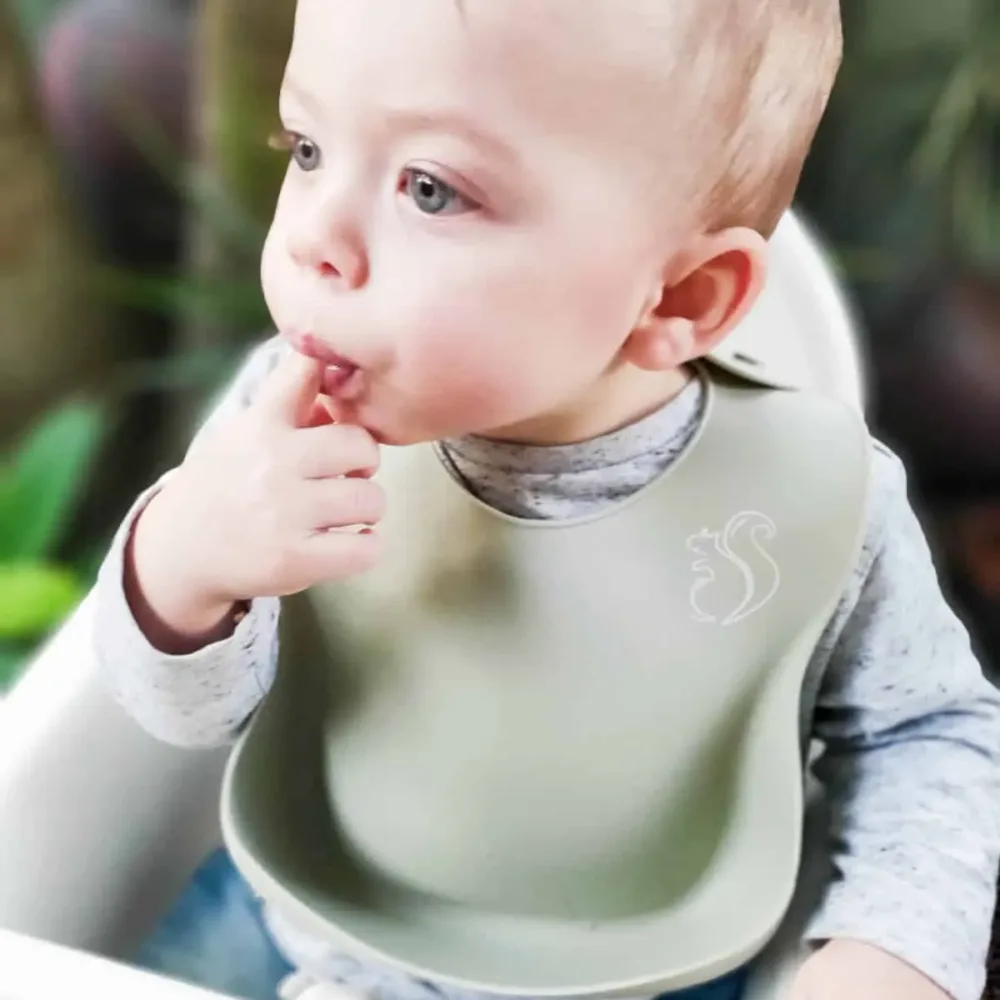 Baby wearing a silicone Bib.