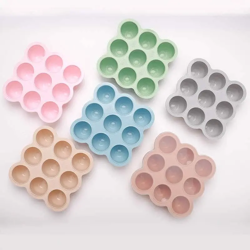 Silicone Baby Food Freezer trays in pink, green, blue, peach, blush and grey.